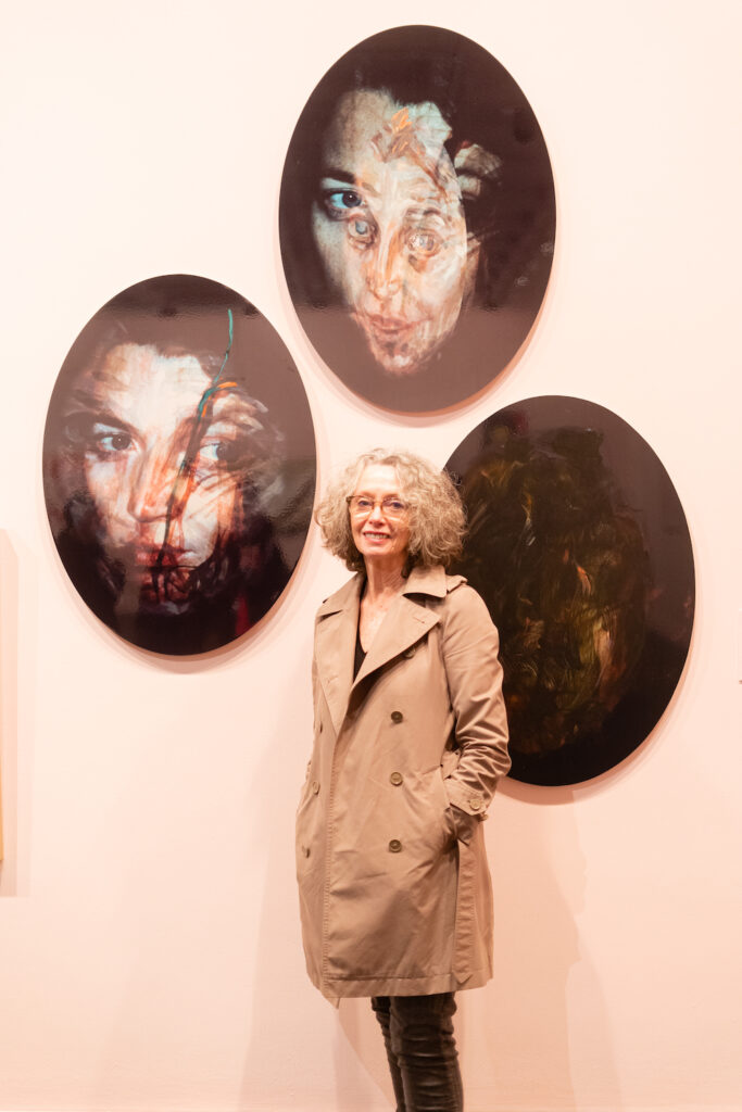 Three portraits on the wall at Lawrence Wilson Art Gallery, of a woman's face, distorted in different ways.