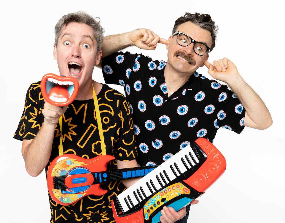 Two guys in loud shirts make silly faces. One is holding a fake laughing mouth in one hand, a child's keyboard in the other. The second man behind him has a finger in each of his ears.
They are The Listies, who will be performing at Fringe World.